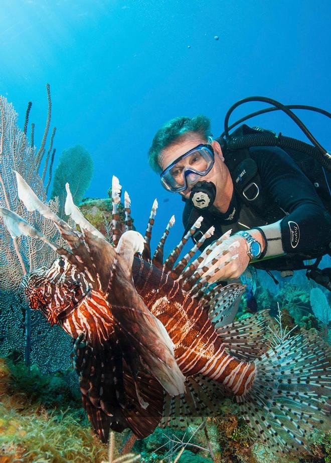 Guy Harvey With Invasive Lionfish © John Bell